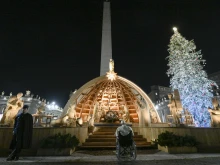 Pope Francis visits the Nativity scene in St. Peter's Square following vespers on New Year's Eve, Dec. 31, 2022.