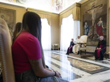 Pope Francis meets with a group of women who escaped criminal organizations in Italy on Oct. 30, 2023, at the Vatican.