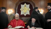 Pope Leo XIV and Ecumenical Patriarch Bartholomew I of Constantinople sign a joint declaration at the Palace of the Ecumenical Orthodox Patriarchate in Istanbul, Turkey, on November 29, 2025.
