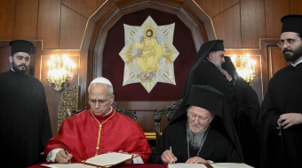 Pope Leo XIV and Ecumenical Patriarch Bartholomew I of Constantinople sign a joint declaration at the Palace of the Ecumenical Orthodox Patriarchate in Istanbul, Turkey, on November 29, 2025.