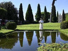 Pope Leo XIV feeds fish during the Sept. 5, 2025, inauguration of Borgo Laudato Si’, an ecological village on the papal estate of Castel Gandolfo, 18 miles south of Rome.
