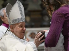 Pope Francis baptizes a baby at the feast of the Baptism of the Lord at the Sistine Chapel, Sunday, Jan. 12, 2025.