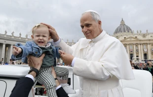 Pope Leo XIV greets a baby during his general audience in St. Peter’s Square at the Vatican on Wednesday, Oct. 22, 2025 Credit: Vatican Media