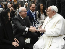 Pope Francis greets pilgrims at his Wednesday general audience in the Paul VI Audience Hall at the Vatican on Feb. 28, 2024.