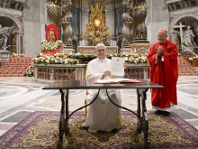 Pope Leo XIV signs his apostolic letter on Catholic education, “Drawing New Maps of Hope,” at the end of a Mass for Rome university students in St. Peter’s Basilica on Oct. 27, 2025. The document was published on Oct. 28, 2025, to mark the 60th anniversary of Gravissimum Educationis, the Second Vatican Council’s declaration on Christian education.