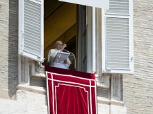 Pope Francis gives a blessing at the end of the Angelus on May 22, 2022