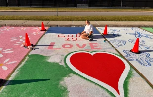 Sabrina Steffans displays her newly decorated school parking space. Credit: Courtesy of First Liberty Institute