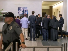 Clergy accompany migrants at a courthouse in San Diego.