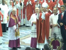 Archbishop Domenico Battaglia holds up the reliquary with the liquefied blood of St. Januarius on the martyr bishop's feast day Sept. 19, 2023. The announcement that the blood had liquefied was made at the start of Mass in the Naples Cathedral by Abbot Vincenzo De Gregorio.