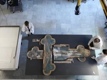 Restorers in the Vatican Museums’ restoration laboratory work on the Cross of Sant’Eutizio.