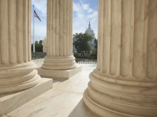 U.S. Capitol viewed through the columns of the U.S. Supreme Court in Washington, D.C.