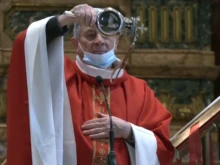 The reliquary of St. Januarius is held by the celebrant at Mass in Naples Cathedral, Italy, Dec. 16, 2021.