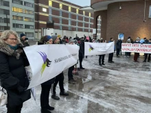 Supporters of Päivi Räsänen Juhana Pohjola outside Helsinki District Court, Finland, on Jan. 24, 2022.