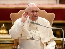 Pope Francis talks to young people in St. Peter’s Basilica, March 15, 2022.