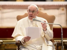Pope Francis talks to young people in St. Peter’s Basilica on March 15, 2022.