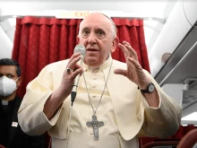 Pope Francis speaks during an in-flight press conference from Malta, April 3, 2022.