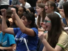 Young students cheer during an assembly at Bishop O’Connell High School in Arlington, Virginia, Saturday, May 10, 2025.