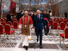 Pope Leo XIV and King Charles III walk together in the Sistine Chapel during a historic meeting that included a prayer service at the Vatican, Thursday, Oct. 23, 2025.