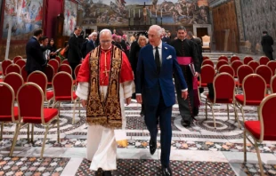 Pope Leo XIV and King Charles III walk together in the Sistine Chapel during a historic meeting that included a prayer service at the Vatican, Thursday, Oct. 23, 2025. Credit: Vatican Media