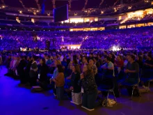 Approximately 24,000 people participate in Eucharistic adoration at the SEEK24 conference Jan. 3, 2024, in St. Louis.