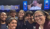 Teens Mia Smothers, Ezequiel Ponce, Micah Alcisto, Elise Wing, and Chris Pantelakis, and moderator Katie McGrady, right, take a “selfie” with Pope Leo XIV during a live digital encounter at Lucas Oil Stadium on Nov. 21, 2025.