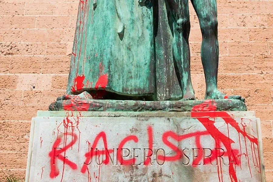 The statue of the Roman Catholic Spanish priest Junipero Serra is pictured in Palma de Mallorca on June 22, 2020, after it was daubed with graffiti reading "Racist." ?w=200&h=150