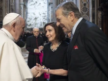 Pope Francis speaks to House Speaker Nancy Pelosi and Paul Pelosi after Mass in St. Peter's Basilica on June 29, 2022.