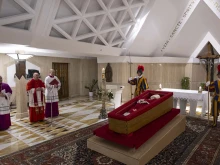 The body of Pope Francis lies in state at the Vatican’s Domus Sanctae Marthae chapel, surrounded by Swiss Guards, cardinals, and Vatican officials paying their respects before his transfer to St. Peter’s Basilica for public veneration, Monday, April 21, 2025.