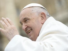 Pope Francis waves to pilgrims in St. Peter's Square gathered for his weekly general audience on April 3, 2024.