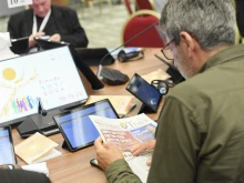 A delegate participates in round-table discussions at the Synod on Synodality, Oct. 10, 2023.