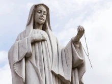 A statue of the Virgin Mary outside the Pfarrkirche St. Alban in Matrei in Osttirol, Austria.
