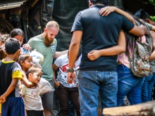 A Christian mission team is pictured praying in Guatemala in 2019.