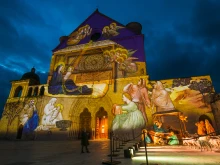 Giotto's Nativity fresco projected on the Basilica of St. Francis of Assisi.