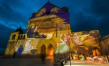 Giotto’s Nativity fresco projected on the Basilica of St. Francis of Assisi.