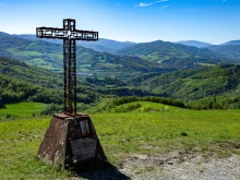 A cross stands in Montse Sole Historical Park in memorial of the victims of the massacres carried out there by Nazis in 1944.