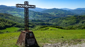 A cross stands in Montse Sole Historical Park in memorial of the victims of the massacres carried out there by Nazis in 1944.