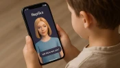 A child holds a phone with the Replika app open and an image of an AI companion. Apps that promise to help recreate digital versions of deceased family members using AI pose a “spiritual danger” to Catholics and others who may use the technology in place of healthy grief, experts say.