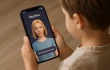 A child holds a phone with the Replika app open and an image of an AI companion. Apps that promise to help recreate digital versions of deceased family members using AI pose a “spiritual danger” to Catholics and others who may use the technology in place of healthy grief, experts say.