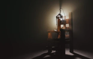 High contrast image of an electric chair scale model. Via Shutterstock