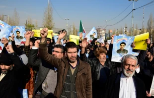 Pro-government demonstrators march in support of the regime after the weekly Friday Prayers, Jan. 5, 2018, in Tehran. thomas koch / Shutterstock