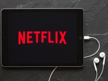 Screen on an iPad showing Netflix logo. 