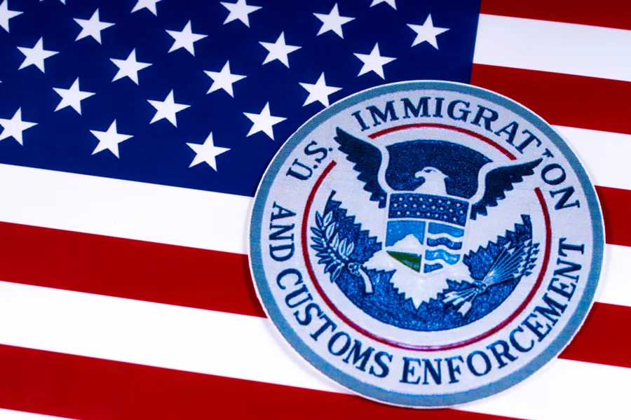 US Immigration and Customs Enforcement portrayed with the US flag. Via Shutterstock?w=200&h=150