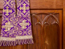 Purple stole and confessional. 