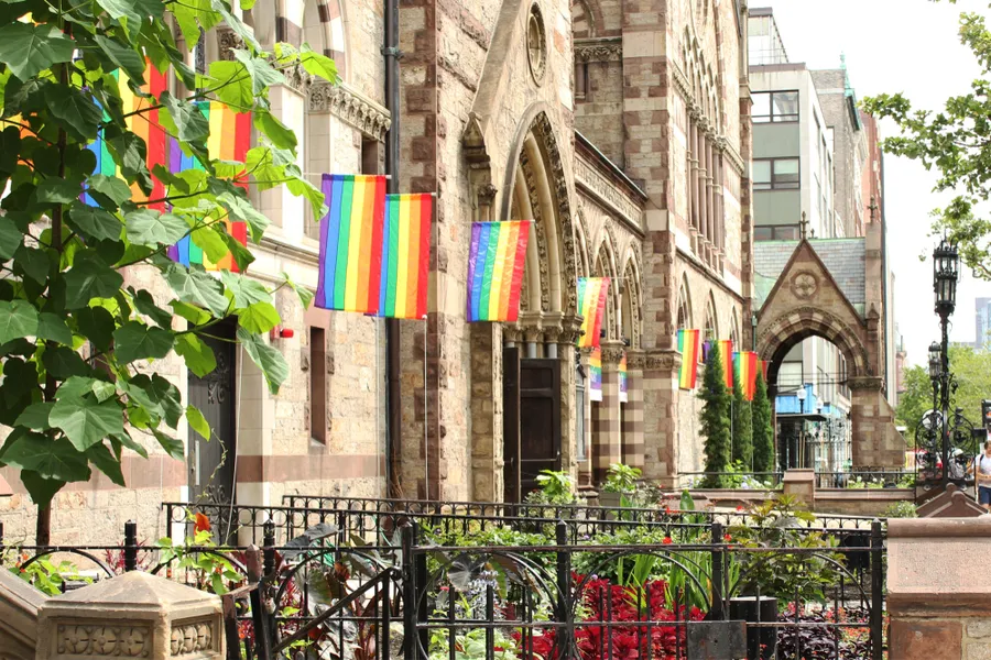 Gay Lesbian Pride Rainbow Flags on Church Building in City. ?w=200&h=150