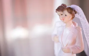 A same-sex wedding cake topper. edwardolive/Shutterstock