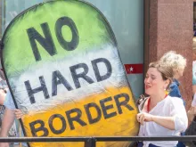 Pro-EU Protester on the Peoples Vote March Holds a Large Homemade Sign About the Brexit Irish Border Issue. 