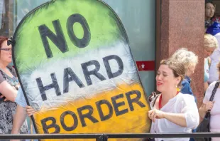 Pro-EU Protester on the Peoples Vote March Holds a Large Homemade Sign About the Brexit Irish Border Issue.   Ian_Stewart / Shutterstock