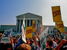 Supporters for and against legal abortion face off during a protest outside the United States Supreme Court.