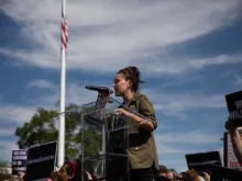 Actress Alyssa Milano, star of direct-to-video Poison Ivy 2: Lily, addresses a crowd in Washington, DC, Sept 2018. 