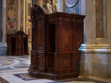 Confession booth in St. Peter's basilica in the Vatican. Via Shutterstock.